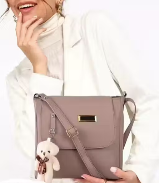 woman siling cross body bag teddy mause