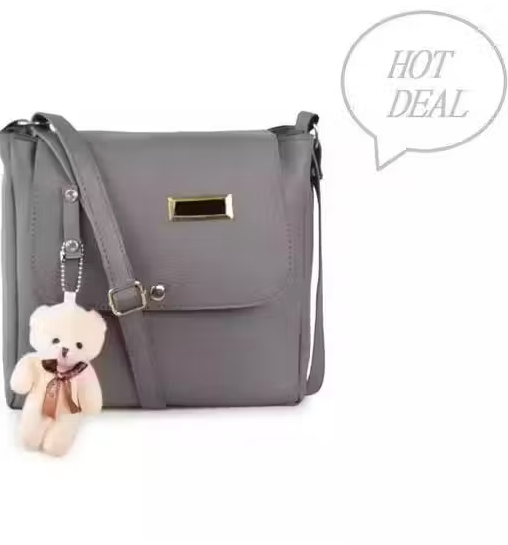 woman siling cross body bag teddy grey